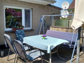 Comfy Bungalow in Fuhlendorf with Terrace, Barbecue, Garden